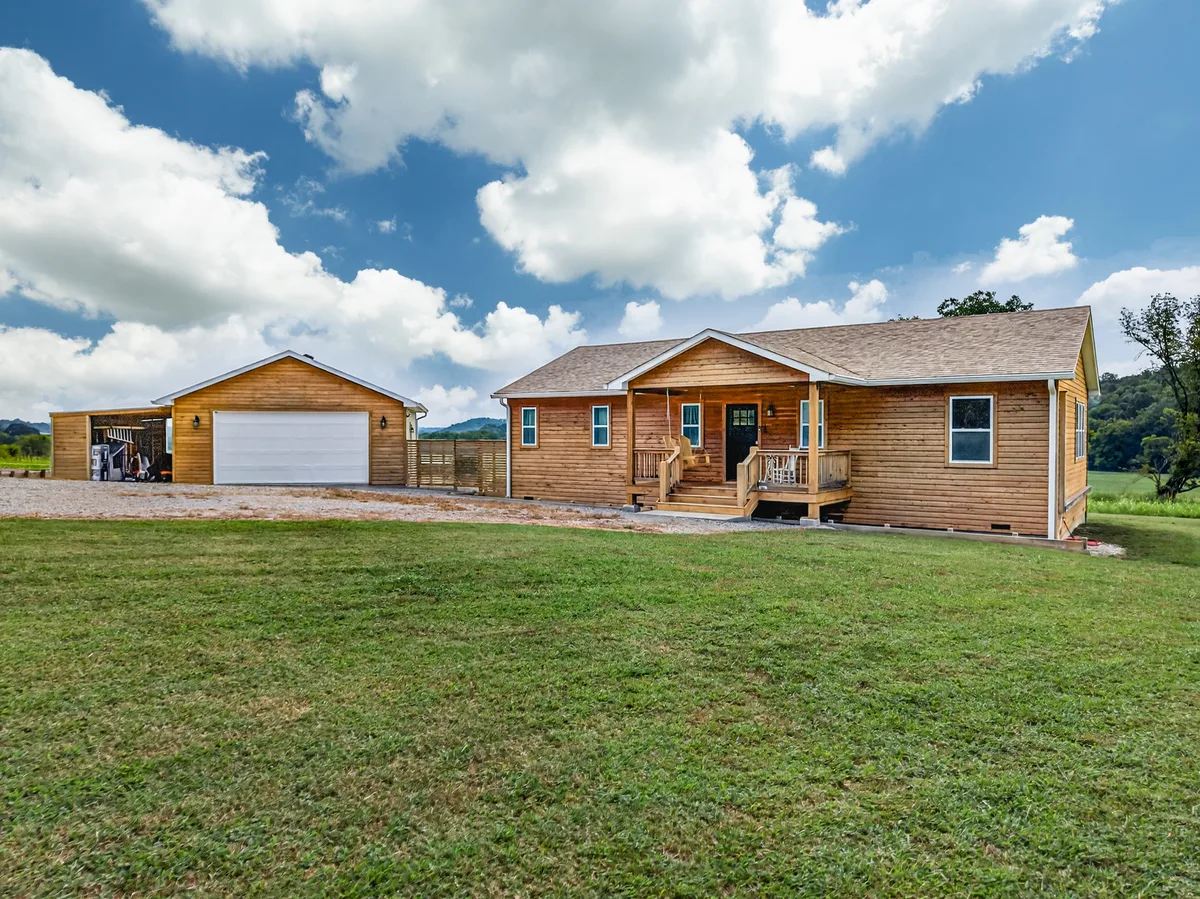 Wood-sided home and detached garage in Pulaski, photographed by Real Tour 360