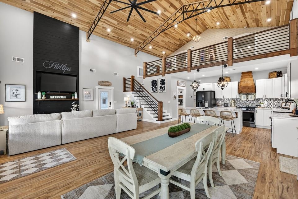 Loft style living room real estate photography with vaulted ceilings