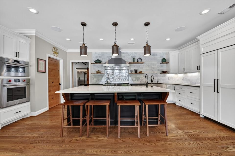 White kitchen real estate photography with large island